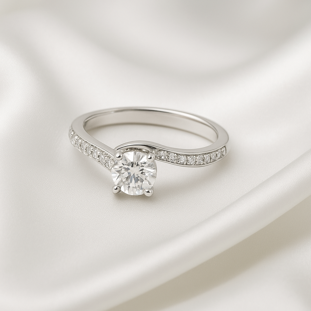 Round cut moissanite engagement ring with twisted pavé band photographed on soft fabric showing elegant silhouette and sparkle