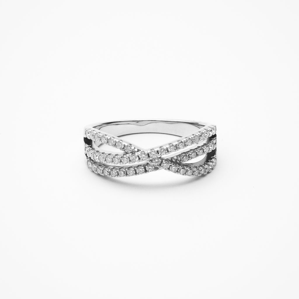 Crossover pavé moissanite wedding band with intertwined design in white gold setting on clean white background