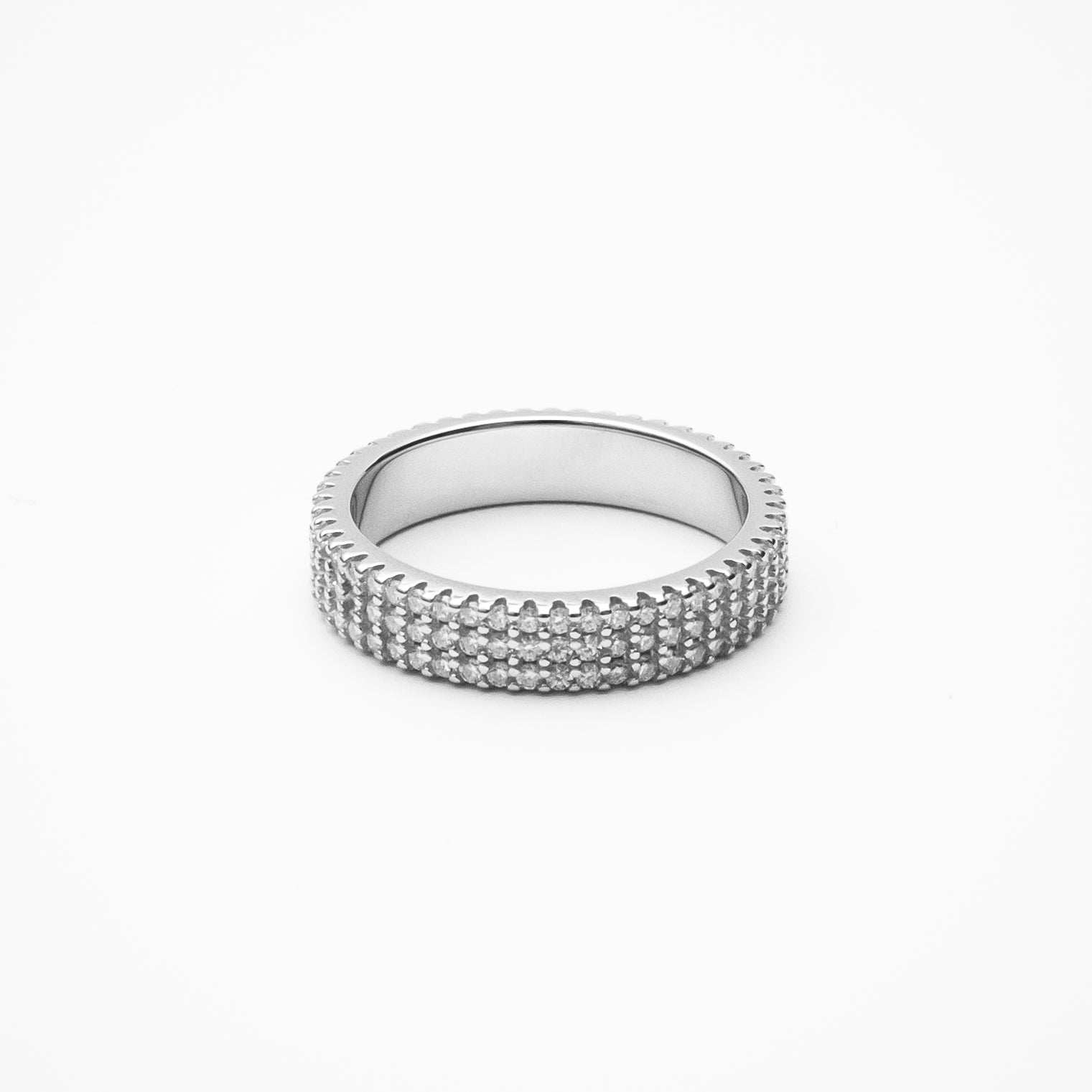 Three-row pavé moissanite eternity band in white gold setting on clean white background showcasing continuous sparkle and elegant width