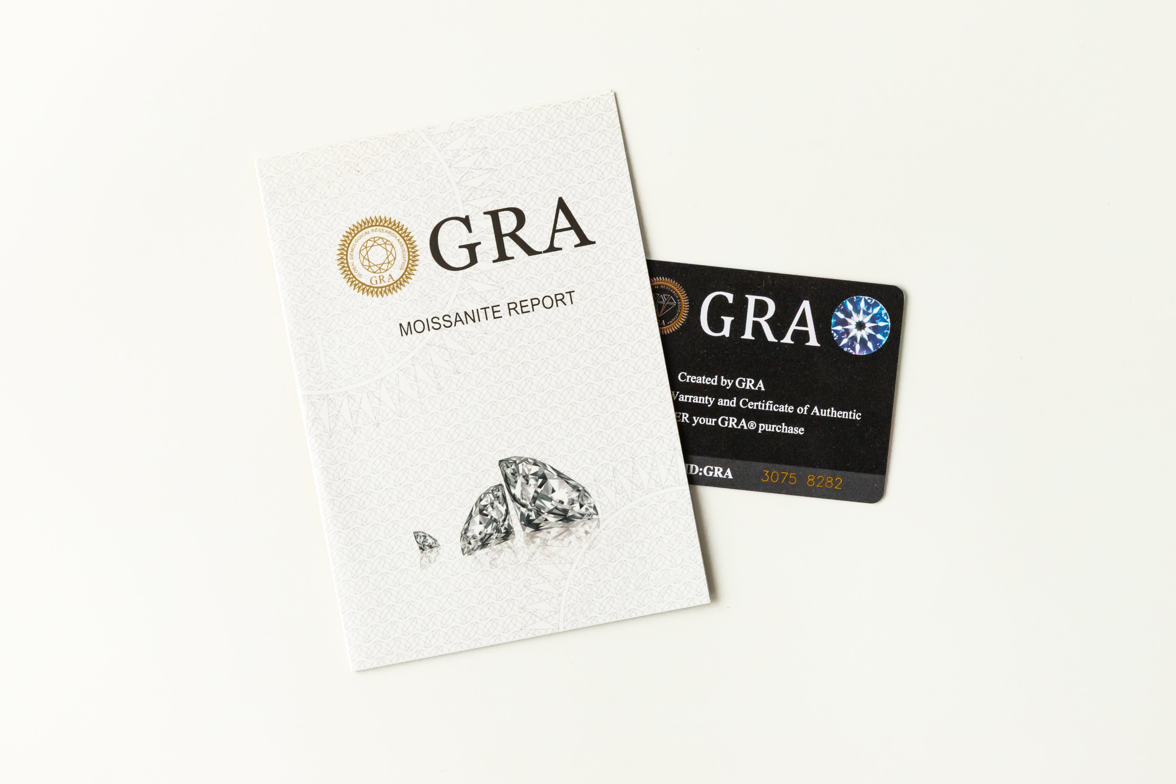 GRA moissanite certification report and authenticity card showcasing official gemstone grading documentation with diamond illustrations and verification details for quality assurance