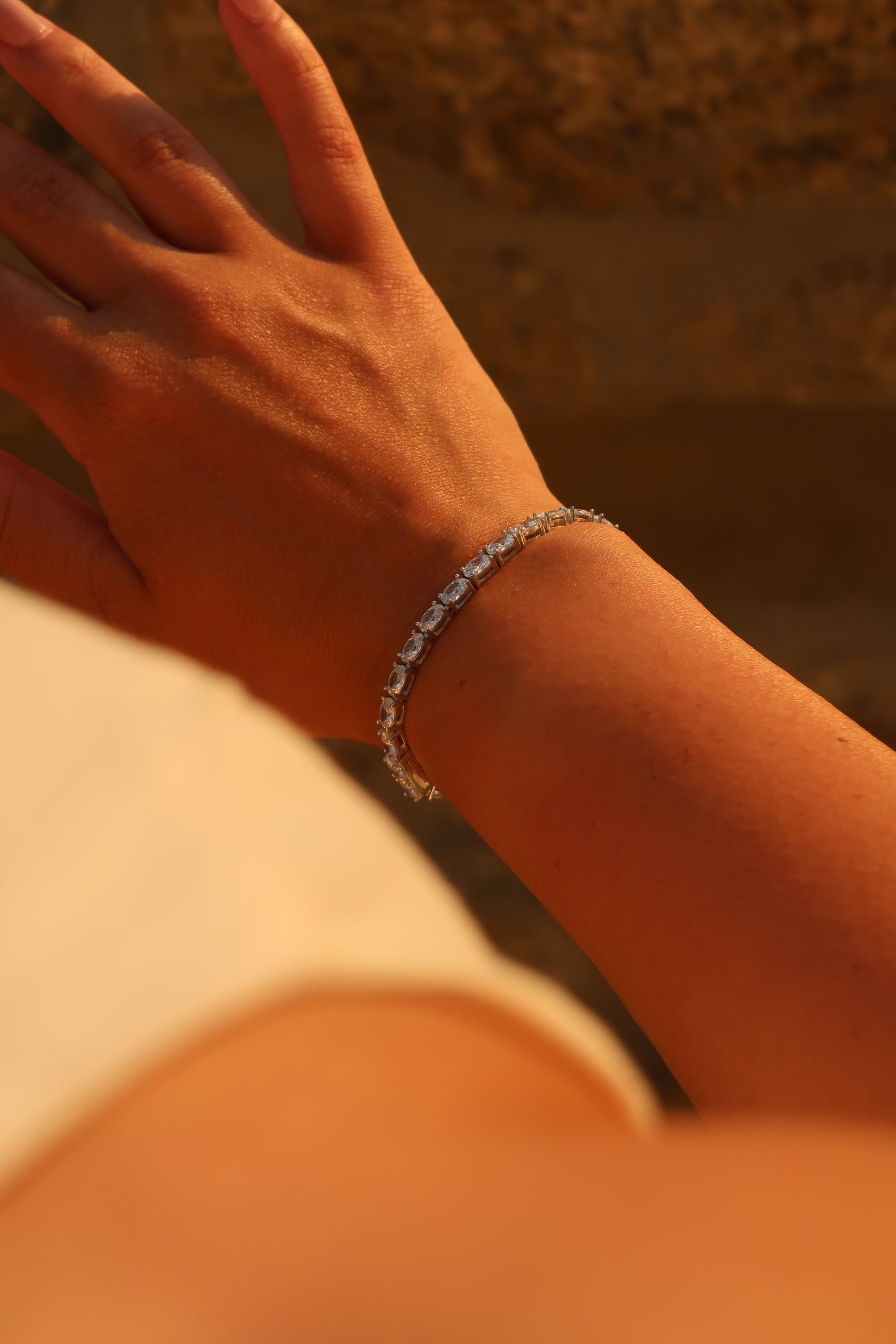 Oval cut moissanite tennis bracelet worn casually demonstrating versatile styling and comfortable wear