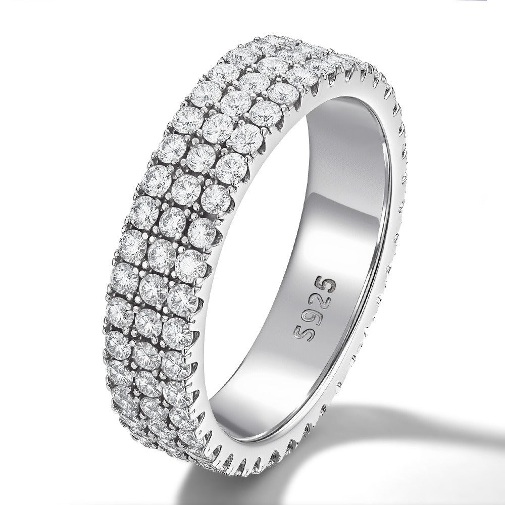 Three-row pavé moissanite eternity band at angle showing depth and brilliant stone setting with multiple rows of sparkling moissanite