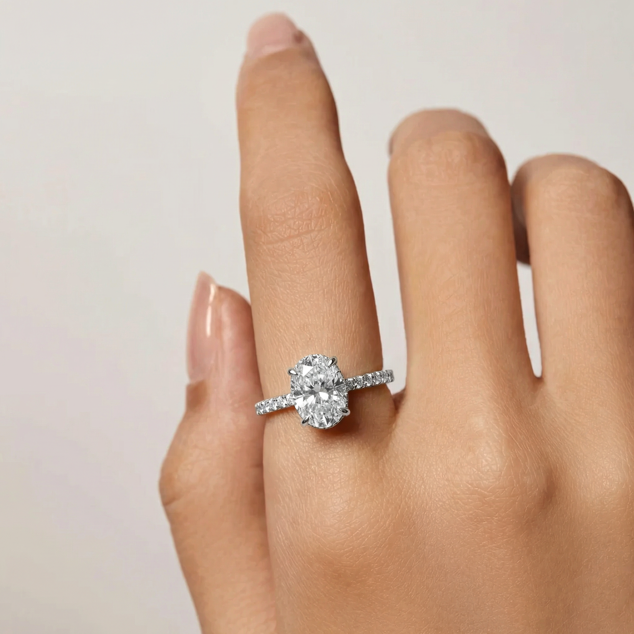 Atheá - Oval Cut Moissanite Solitaire with a Pavé Band